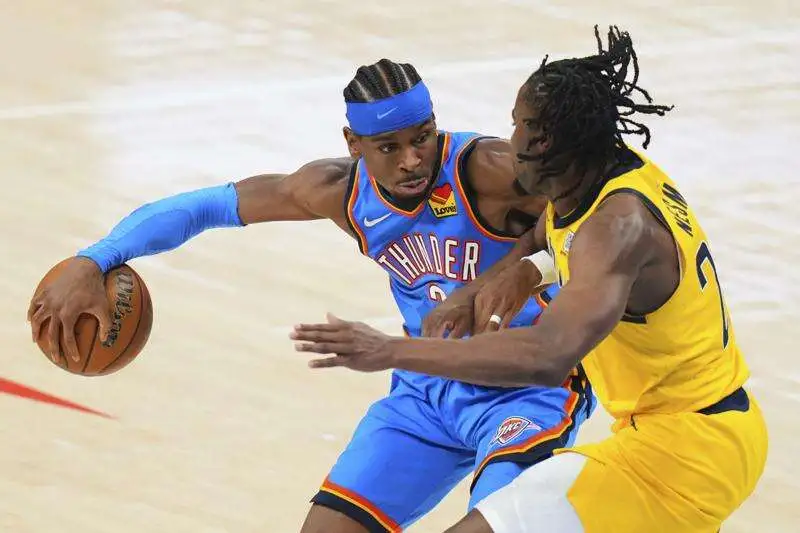 Aaron Nesmith defends Shai Gilgeous-Alexander as Oklahoma City Thunder’s tactics unfold during NBA Finals Game 2.
