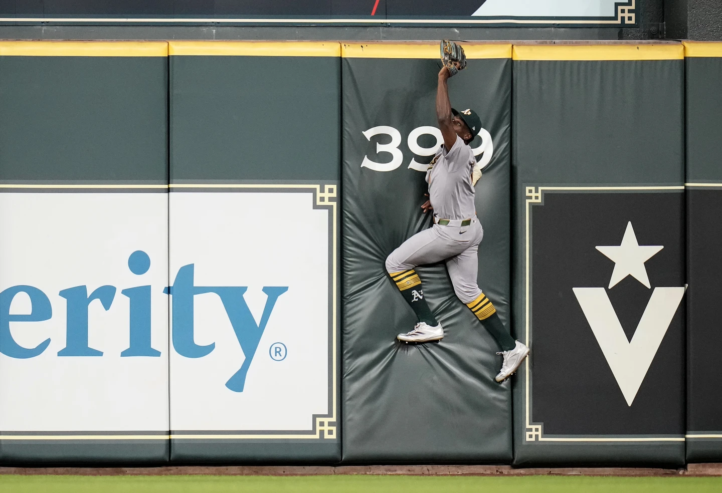 Denzel Clarke's historical catch as he robs a home run at Angel Stadium, leaping against the outfield wall
