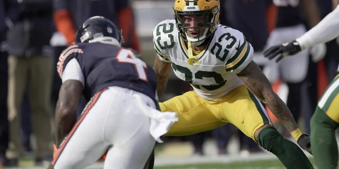 Jaire Alexander stands alone on the field, capturing the emotion and uncertainty surrounding Jaire Alexander's exit from Packers